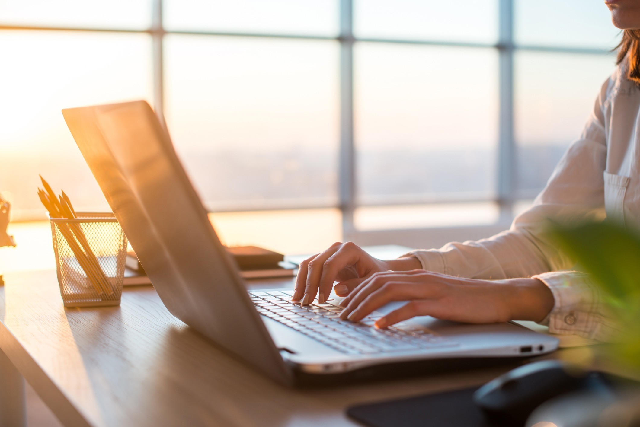 close up of woman on a laptop